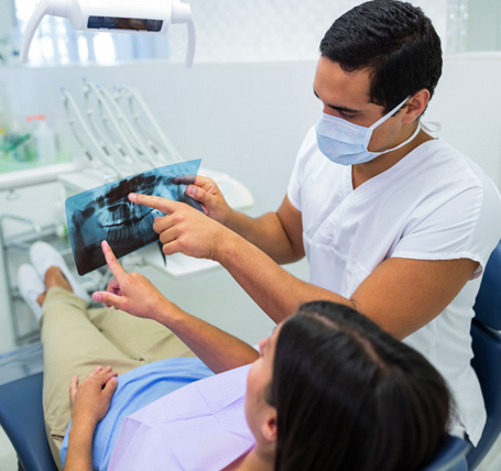 Dentistry faculty working with students at SEGi University and Colleges