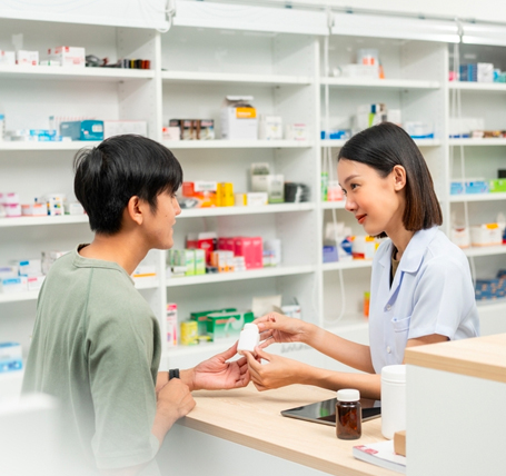 Pharmacy faculty working with students at SEGi University and Colleges