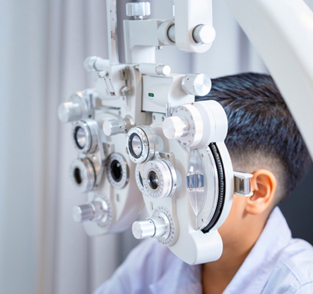 Optometry faculty working with students at SEGi University and Colleges